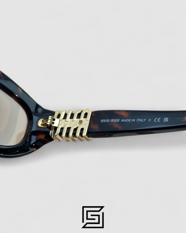 Miu Miu MU14 141-90H Light Brown Lenses and Tiger Brown Frame With Gold Logo